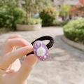 Close-up of a purple vintage floral scrunchie with white rose relief and pearls detail - Oval Hair Tie