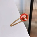 Close-up of vintage resin hair clip with embedded white dried flower and shell fragments - Round Red Base Dried Flower Style (D款)