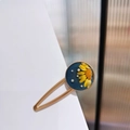 Detail of vintage oil painting style hair clip with navy resin and yellow dried flowers - Round Blue Base Dried Flower Style (C款)