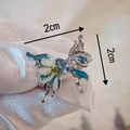 Handmade butterfly ring with real dried flowers and blue gemstone in a natural vintage style - White Snowflake Butterfly