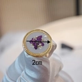 Detail view of handmade resin flower ring with purple petals and 2cm gold twisted frame - Style C