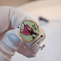 Detailed close-up of handmade resin ring with red dried flowers and a tiny pearl inlay - Style E