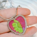 Macro detail of heart pendant with pink resin, real dried flower and rhinestone frame - Green Dried Flower with Pink Base (Style K)
