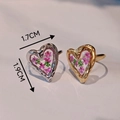 Macro shot of gold and silver heart rings with pink dried flowers and 1.7x1.9cm dimensions - Hammered Heart Lace Flower Style (Silver)