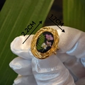Detailed macro view of vintage oval resin ring with dried botanical flowers and fern - Pink & White Floral & Green Leaf Specimen (Style B)