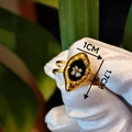 Detail view of a vintage gold ring with a 1.7cm black oval face and white flower inlay - Simple White Small Flower Oval Style (Style G)