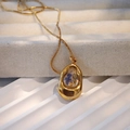Detailed macro of a handmade golden necklace featuring real blue and yellow dried flowers - Blue Yellow Flower Gold Frame (Style E)