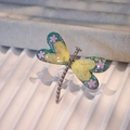 Macro shot of colorful resin wings with flower detail on dragonfly stainless steel ring - Blue-Yellow Gradient Dried Flowers Silver Base (Style B)