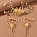 Elegant bridal hair accessory set with gold floral patterns and delicate pearl beadwork - Hair Comb And Hair Pin Set