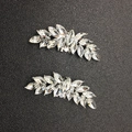 Detailed close-up of leaf-shaped alloy shoe clips with marquise-cut rhinestones - Silver
