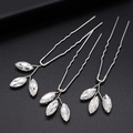 Detailed view of three silver bridal hair pins with marquise-cut crystal leaves on black base - Leaf Design Hair Pin / Silver