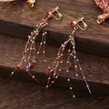 Élégantes boucles d'oreilles à clip pompons dorés et cristaux cœur rouges sans perçage - Boucles d'oreilles à clip / Rouge