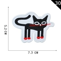 Cartoon black cat embroidery patch with red details and 7.3x5.2 cm size scale - Black Cat with Red Paws (P20200030306)