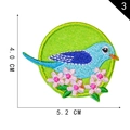 Blue bird and pink flower embroidered patch with green background on variant view - Bird in Flowers (3)