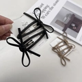 Set di due fermagli per capelli a fiocco in pelle PU nero e kaki con design coreano - Nero