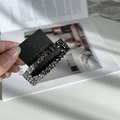 Detailed close-up of sparkling black and silver rhinestone hair clip on display card - Gradient Black Gray (Rectangular Shape)