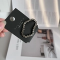 Detail of grey rhinestone hair ring on display card showing sparkling faceted crystals - Gray
