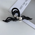 Elegant black hair claw clip with white camellia flower and pearls on a white background - Beige