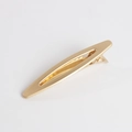 Detail shot of a matte gold alloy hair clip with a minimalist hollow oval cutout design - Hollow Oval Style / Gold