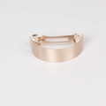 Detail view of rose gold curved metal hair clip with a brushed texture and spring mechanism - Fine Style / Rose Gold