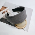 Detail view of dark grey ribbed knit headband showing thick texture and inner black lining - Light Gray