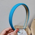 Detail of peacock blue satin headband with non-slip inner lining and smooth fabric texture - Azure Blue