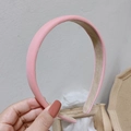 Detail showing pink padded sponge headband with fine texture and non-slip inner beige lining - Pink