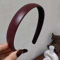 Close-up of deep burgundy headband featuring premium lychee texture leather finish - Burgundy