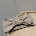Close-up of dark grey ribbed knit headband with large bow detail and soft fabric texture - Khaki