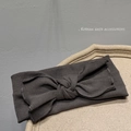Detailed texture of dark grey ribbed knit headband with large stylish bow decoration - Light Chocolate