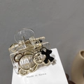 Transparent acrylic hair claw clip with golden bear and black bow, Korean style hair accessory - Clear Gold