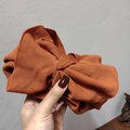 Chic orange-red oversized knit bow headband with elastic ribbed texture for women - Pumpkin Orange