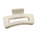 Close-up of matte cream hair claw clip with rectangular hollow design for styling - Apricot