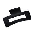 Detailed view of the black flocked rectangular claw clip with a hollow design on white back - Black