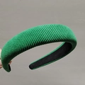 Close-up of green twill knit sponge headband with premium texture and black lining - Green