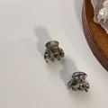 Detail van kleine acetaat haarklemmetjes met marmer- en schildpadpatronen - Groen Veelkleurig