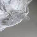 Detail of a large transparent acrylic claw clip with a five-sphere design on a white background - Light Blue