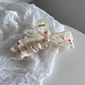 Dettaglio molletta per capelli in chiffon a pois con fiocco e perla elegante - Beige