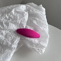 Detail of magenta fabric-covered oval hair clip with textured weave on white paper - Rose Red