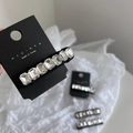 Detail of K9 crystal snap hair clip with rectangular rhinestones on a black base - White