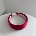 Detail of red fabric headband showing textured ribbed material and anti-slip lining - Red