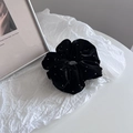 Close-up of black velvet scrunchie with silver sparkles on elegant white background - Black