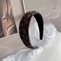 Detail of vintage brown floral headband with thick padded texture on elegant background - Floral Headband