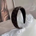 Detail view of brown vintage floral headband featuring cotton fabric and anti-slip lining - Headband