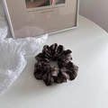Close-up of a brown plaid scrunchie hair tie with soft fabric texture and Korean style - Plaid Scrunchie