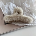 Close-up of the plush faux fur texture and sturdy claw design on the beige hair clip - Beige