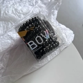 Set of 12 black spiral elastic hair ties in a clear branded box with a laser bow design - Black