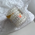 Clear spiral phone cord hair ties set in a square plastic box with colorful BOW logo - White