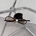 Detailed macro view of dark brown velvet bow scrunchie with metallic silver pendant - Dark Brown Suede Leopard Bead Style / Khaki