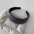 Detail of grey tweed headband with blue plaid texture on a soft cushion display - Grey Plaid Style (TK75A)